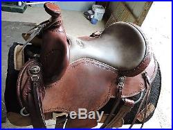 14, barely used, Clinton Anderson western saddle. Brown