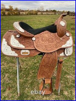 17 Western show saddle with tooled light oil leather, raised star silver