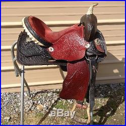 Used 15 black / red leather Western barrel race saddle good condition