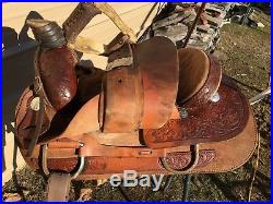 Used 16.5 Santa Fe Western roping saddle withtooled skirts, rough out fenders