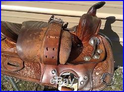 Used Simco 15.5 tooled Western trail / pleasure saddle withsilver conchos US made