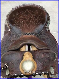 Used Vintage Circle Y western equitation saddle, dark brown fully tooled 15 inch