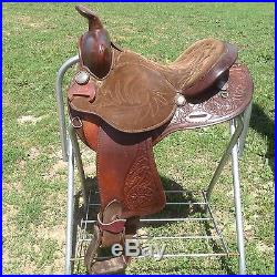 Used/vintage 15 tooled Western barrel race saddle withsilver conchos US made