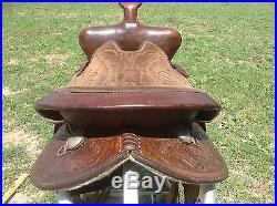 Used/vintage 15 tooled Western barrel race saddle withsilver conchos US made