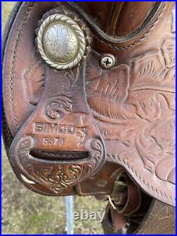 Used/vintage Simco 15 tooled Western saddle withsilver conchos